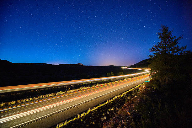 istock Starry Night over Highway Light Trails, Elevated View - Sedona, Arizona 2216270984