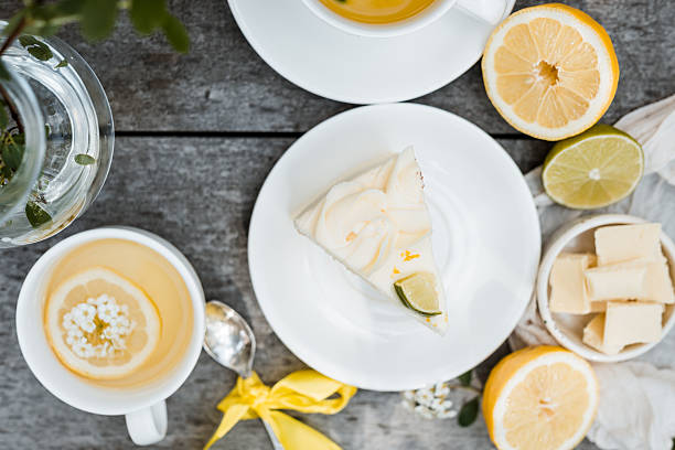 istock elegant lemon-lime sponge cake slices drizzled with silky white chocolate syrup, arranged on vintage floral plate 2216273327