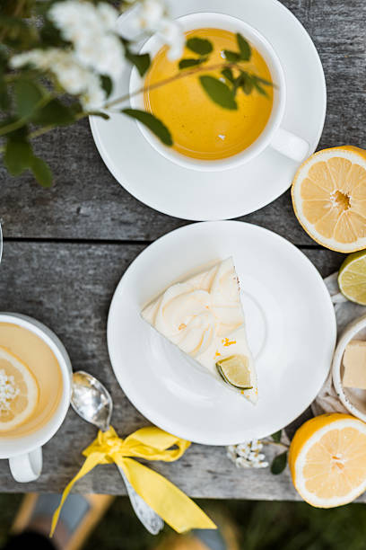 istock elegant lemon-lime sponge cake slices drizzled with silky white chocolate syrup, arranged on vintage floral plate 2216273329