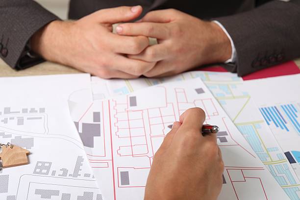 istock Real estate agent working with client at table, closeup 2216274065