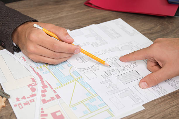 istock Real estate agent working with client at wooden table, closeup 2216274088
