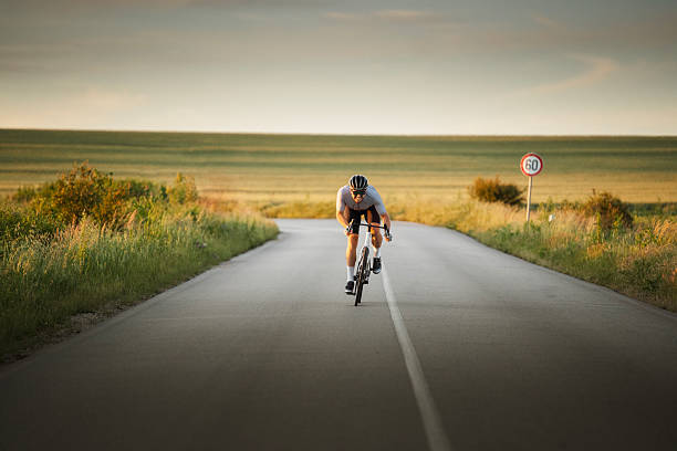 Side view of male cyclist, blurred background