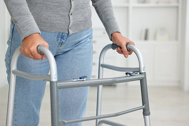 istock Senior woman with walking frame at home, closeup 2216275736