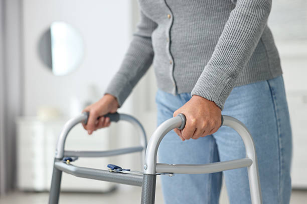 istock Senior woman with walking frame at home, closeup 2216275757