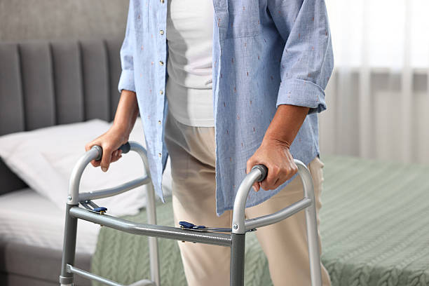 istock Senior woman with walking frame at home, closeup 2216275779