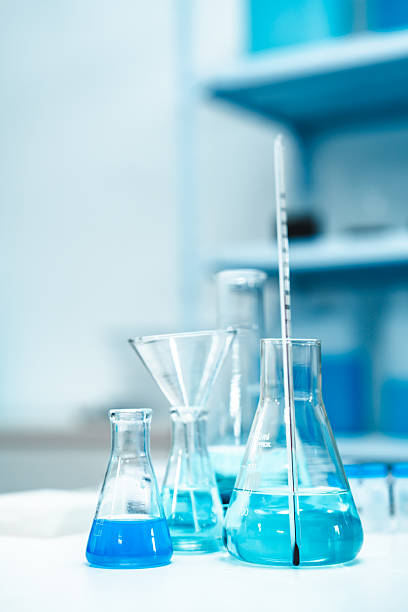 istock Glass labware with blue liquid in a modern science laboratory, representing chemical research, technology, and scientific experiments in a controlled environment. 2216276141
