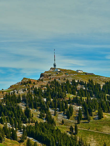 istock Mountaintop landscape features communication tower surrounded by lush green forest under a clear sky 2216277742