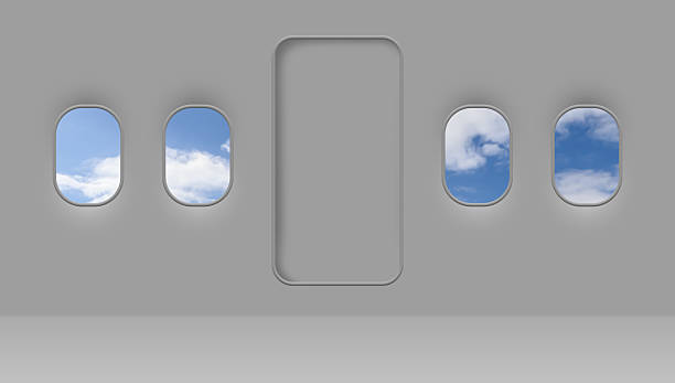 istock Beautiful sky with clouds, view through airplane windows in grey sidewall of cabin 2216280649