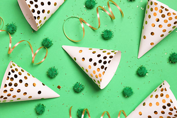 istock Festive composition with shiny confetti and party decor on green background, flat lay 2216280757