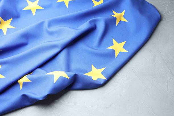 istock Flag of European Union on light grey table 2216280881