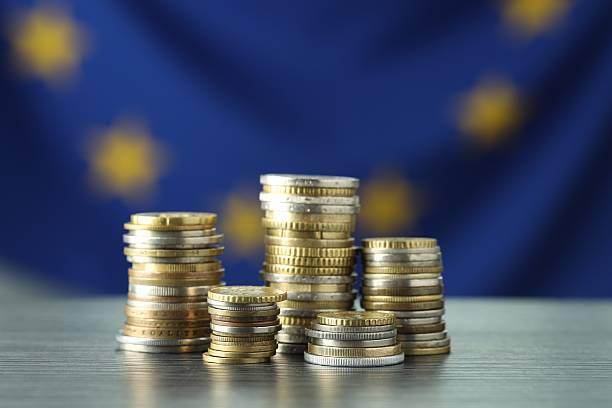 istock Stacks of euro coins on grey textured table, closeup 2216280888