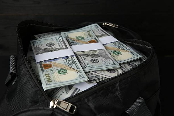 istock Dollar banknotes in bag on table, closeup 2216281661