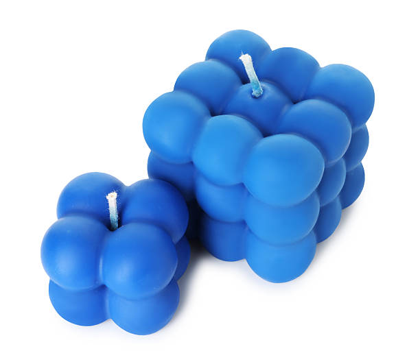 istock Two blue bubble candles isolated on white 2216282133