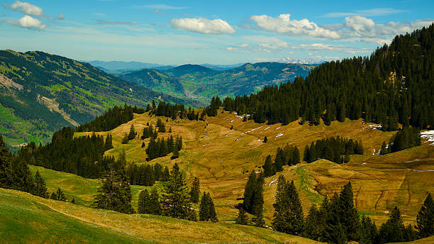 istock Breathtaking mountainous landscape filled with lush greenery and rolling hills under a bright blue sky 2216282431