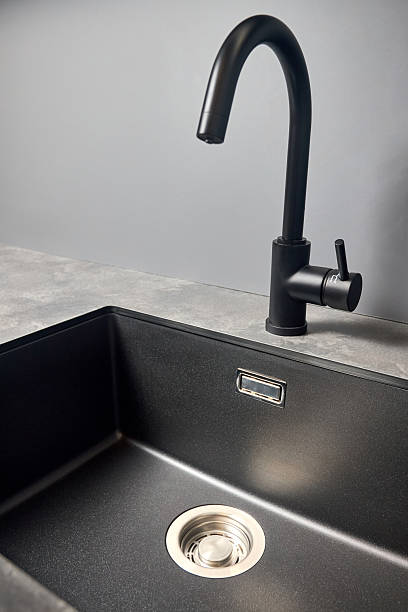 istock Single handle water filter kitchen faucet for reverse osmosis or water filtration system built in compact high pressure laminate HPL countertop. Kitchen undermount installation granite composite sink. 2216286047