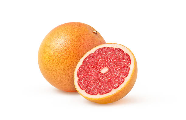 istock Juicy grapefruit and a half isolated. Halved grapefruit. Grapefruit cut and whole grapefruit. 2216286693