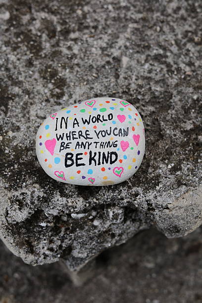 istock Ancient stone object with be kind kindness rock vertical photo 2216287444