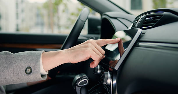 istock Side view of caucasian female hand which typing needed coordinates on navigator touchscreen with modern assistance functions 2216287704