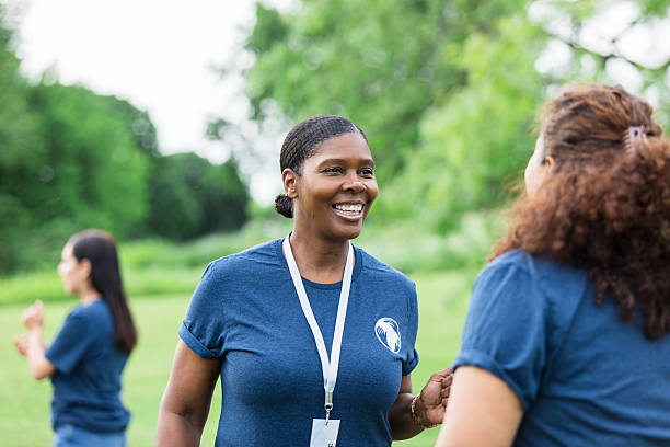 istock Two Women Volunteers Chatting Outdoors, Happy Smiles 2216289048
