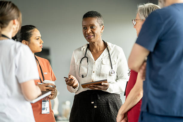 istock Medical Team Having a Discussion in a Hospital Setting 2216289633