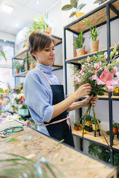 istock Florist arranging a bouquet 2216292097
