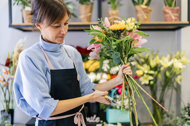 istock Florist arranging a bouquet 2216292110