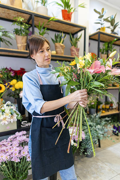 istock Florist arranging a bouquet 2216292111