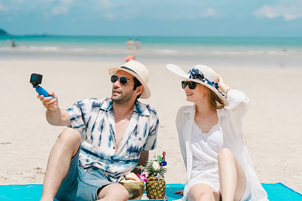 istock young couple walking on white sand beach on paradise island. 2216292927