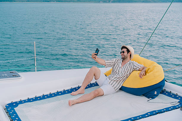 istock Man outdoors posing on yacht in sea. 2216292969