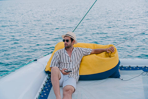 istock Man outdoors posing on yacht in sea. 2216292970