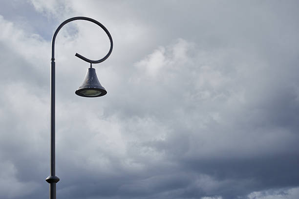 Street lampposts and rainbow