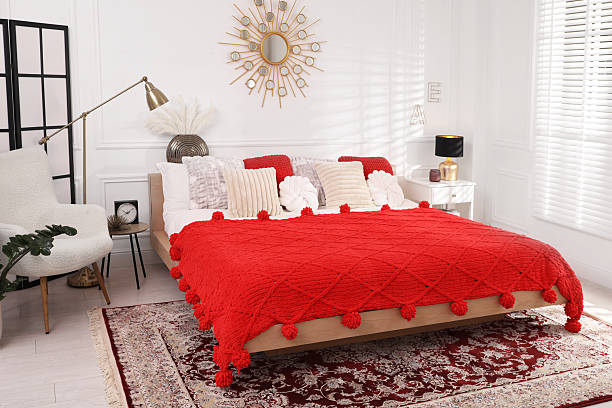 istock Big comfortable bed and decorative elements in room. Stylish bedroom interior 2216294206