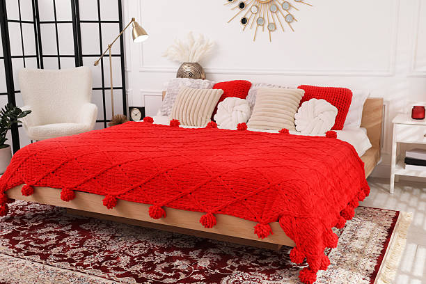 istock Big comfortable bed and decorative elements in room. Stylish bedroom interior 2216294221