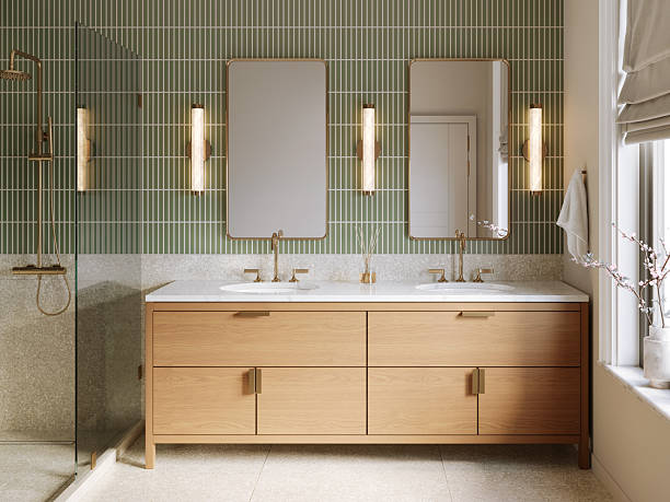 istock 3d render - a modern bathroom with green wall tile and terrazzo wall and floor tile, brass plumbing fixtures , brass mirrors and marble countertop 2216294451