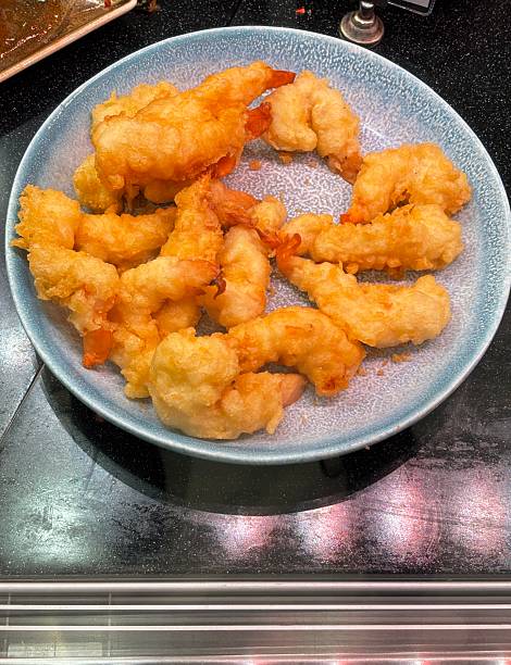 istock Fried shrimps in batter on a round plate 2216295980