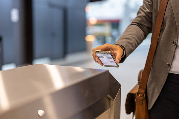 Businessman using smartphone to access office building
