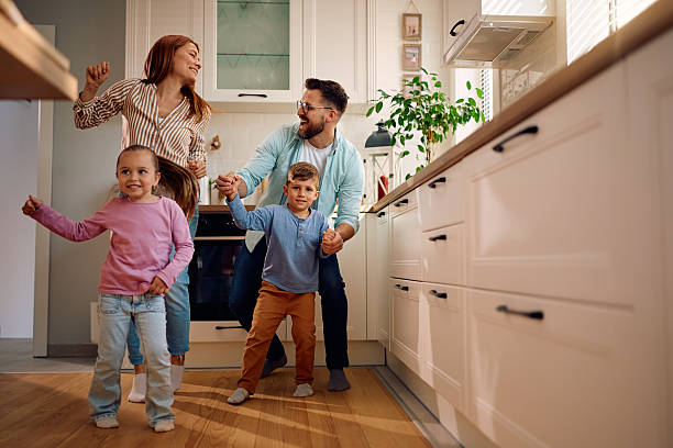 istock Playful parents having fun with their kids at home. 2216296678