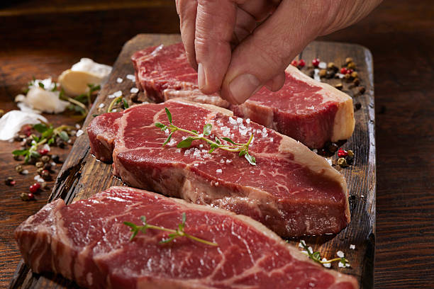 istock Raw Grass Fed, Organic New York Strip Steaks 2216297430