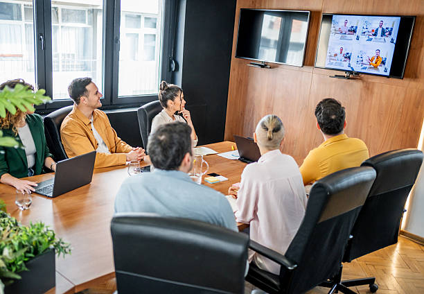 istock Business team having video conference in modern office 2216299702