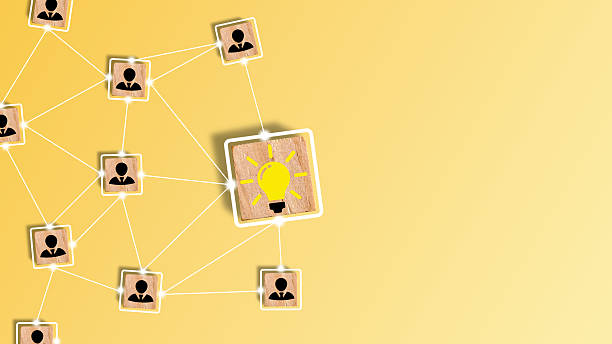 istock Conceptual of creative idea and innovation. Creative idea and innovation concept. Hand assembled wooden cube block with a light bulb icon on top of a pyramid and a question mark 2216300710