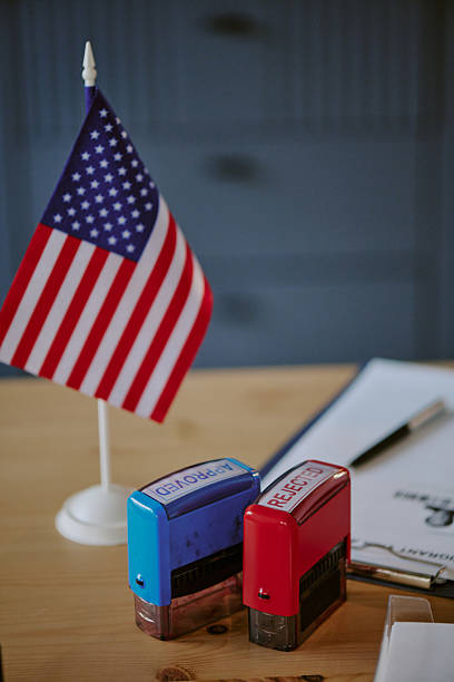 istock American Flag Displayed with Stamps and Clipboard on Desk 2216300751