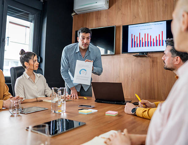 istock Businessman leading a presentation during a corporate meeting 2216300875
