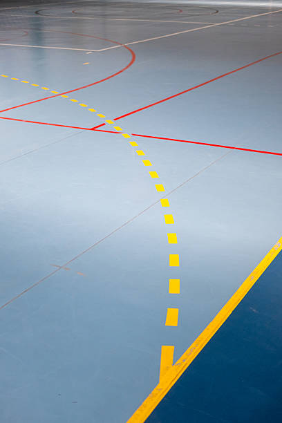 Playing field lines in a multi-sports pavilion indoor practice