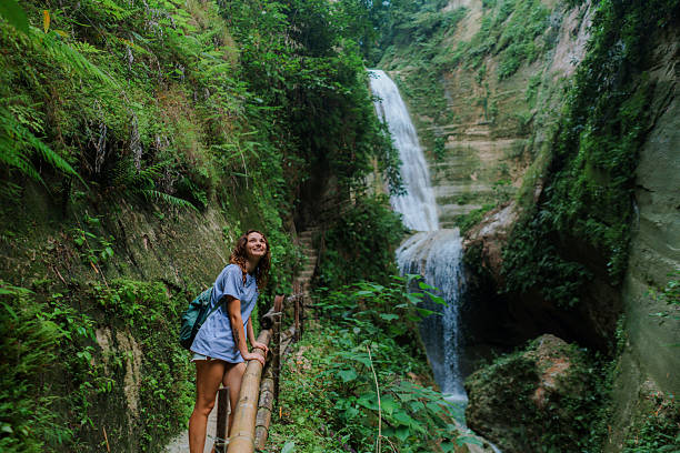 Woman hiking in river canyon on Cebu island  during trip to Philippines