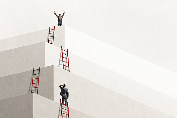 istock Man Looking Up At  Woman Who Has Reached The Top 2216305456