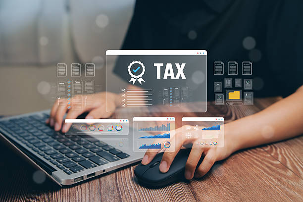Tax Preparation Process with Digital Interface and Business Analytics Displayed on Laptop Screen