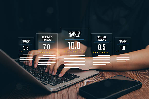 istock User Engagement and Customer Reviews with Ratings Displayed on Digital Screen Over Hands Using Laptop 2216305650