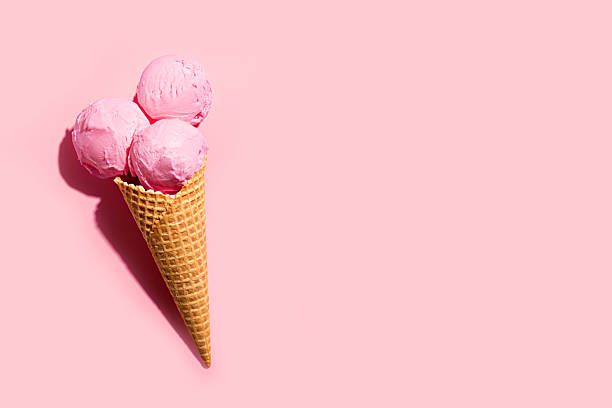 istock Strawberry pink ice cream scoops in waffle cone on pink background 2216306770