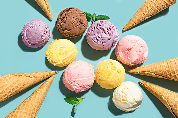 istock Ice cream scoops and waffle cones on blue background 2216306854
