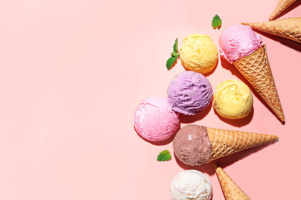 istock Ice cream scoops and waffle cones on pink background 2216306909